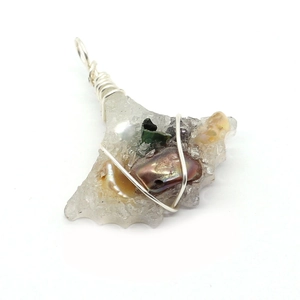 Artistic leaf-shaped resin pendant with natural pearl and wire wrapping on white background