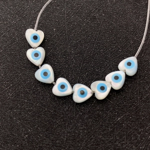 Natural heart shell beads featuring blue evil eye pattern for DIY jewelry crafts