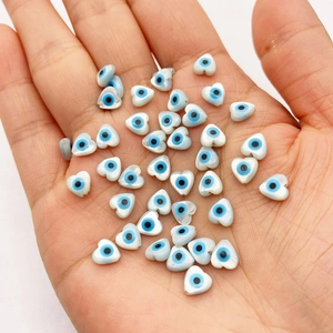 Handheld heart-shaped shell beads with evil eye design for DIY jewelry making
