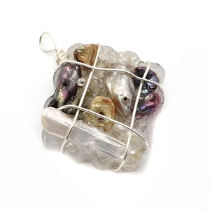 Detailed close-up of handmade wire-wrapped square pendant with baroque pearls and crystals