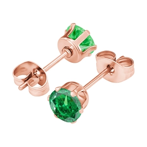 Close-up of rose gold four-prong stud earrings with faceted round green stones