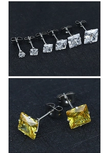 Detailed macro view of princess cut cubic zirconia studs with secure 4-claw settings