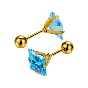 Detailed macro view of square blue zircon earrings with gold screw-back ball closures