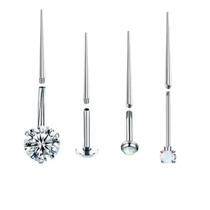 Detailed macro view of 316 stainless steel insertion pins and threaded piercing jewelry