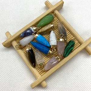 Bullet-shaped natural stone pendants with gold metal loops in various colorful textures
