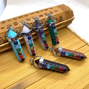 Detailed macro view of 7 chakra natural stones in hexagonal prism shapes on bamboo mats