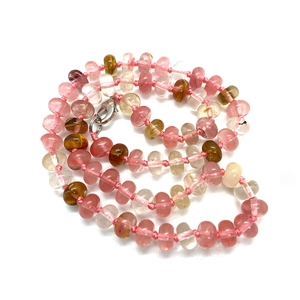 Close-up of pink natural stone abacus beads necklace with silver lobster clasp and knots