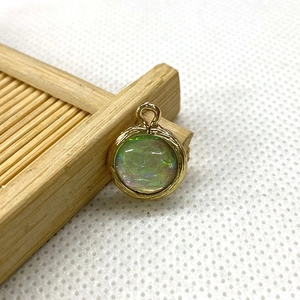 Golden round crystal stone pendant with iridescent green center for DIY necklace making