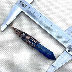 Detailed measurement of lapis lazuli hexagonal pendant with ornate bronze cap and size scale