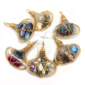 Set of six wire wrapped baroque pearl and natural stone pendants in golden finish