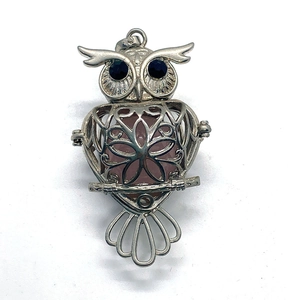 Silver owl hollow pendant with pink natural stone ball and black gemstone eyes