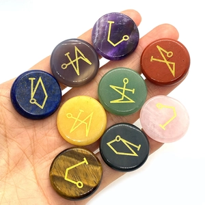 Set of 9 healing energy stones with engraved golden runes for meditation and ritual use