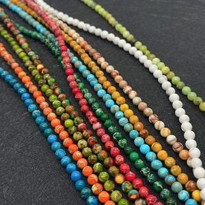 Macro detail of colorful imperial jasper and turquoise round beads for DIY jewelry making