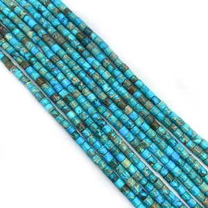 Macro view of natural imperial jasper cylinder beads with unique turquoise texture