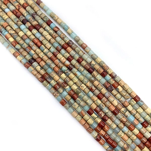 Macro shot of assorted cylindrical natural stone beads for DIY jewelry in earthy tones