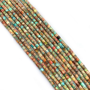 Detailed macro view of colorful cylindrical emperor stone beads for DIY jewelry making