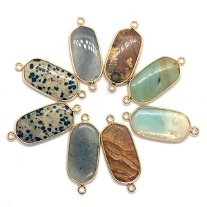 Oval natural stone pendants with gold metal frames and double loops for jewelry making