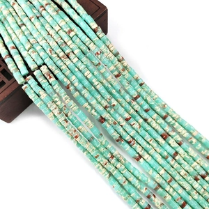 Macro shot of turquoise column beads with brown marble texture for DIY jewelry making