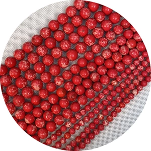 Polished red imperial jasper stone beads with white marble patterns in various sizes