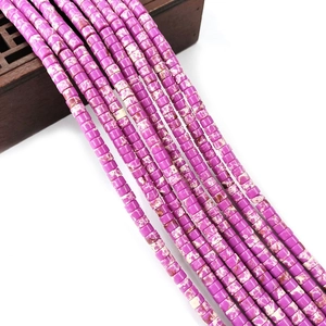 Close-up of pink imperial jasper cylindrical stone beads for DIY jewelry making