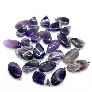 Polished amethyst stone pendants in teardrop and oval shapes with silver metal loops