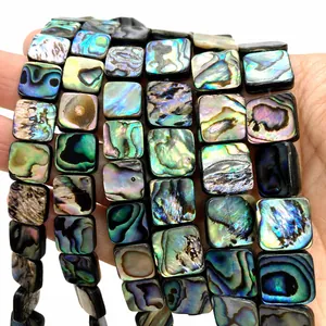 Macro detail of square abalone shell beads with natural iridescent luster for DIY jewelry