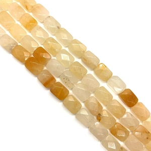 Macro shot of rectangular faceted natural agate beads in yellow and honey gradients