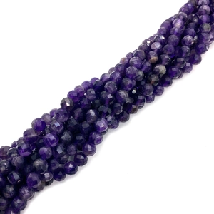 Macro detail of faceted natural purple amethyst beads for DIY jewelry making