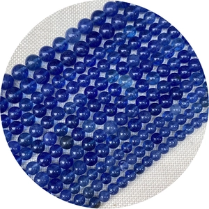 Cuentas redondas de piedra natural azul pulida para bisutería DIY sobre lino