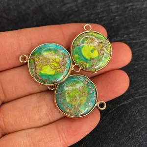 Detailed view of natural imperial stone pendants with gold plating and double connectors