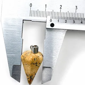 Macro view of natural jasper cone pendant measured with calipers showing 1.5cm width