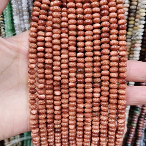 Macro detail of sparkling goldstone abacus beads for DIY jewelry and necklace making
