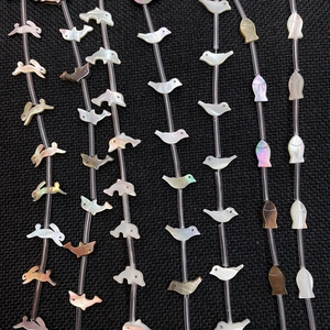 Natural shell beads in animal shapes like rabbit and dolphin for DIY jewelry making