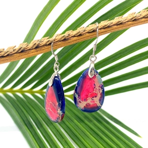Waterdrop natural stone earrings with S925 silver hooks on a tropical palm leaf background