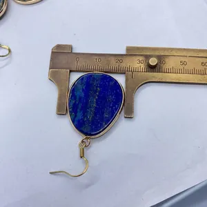 Macro shot of a 25mm lapis lazuli teardrop earring measured with a digital caliper