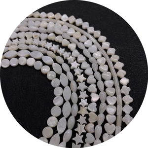 Natural white shell beads in heart, star, and clover shapes for DIY jewelry making