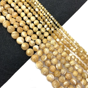 Natural shell beads for DIY jewelry making in creamy gold with iridescent luster