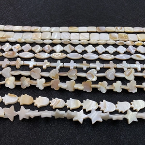 Natural mother of pearl shell beads in flower, heart, and star shapes for DIY jewelry