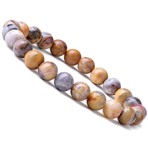 Primer plano de pulsera de cuentas de piedra natural con texturas amarillas y grises sobre blanco