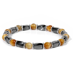 Macro shot of natural tiger eye beads and faceted hematite stones on an elastic bracelet