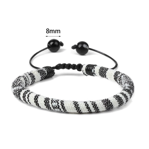 Bohemian black and white woven bracelet with adjustable sliding cord and 8mm beads