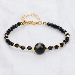 Detail van 4mm gefacetteerde zwarte kralen met gouden obsidiaan en verstelbare sluiting