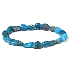 Detailed macro view of natural irregular blue apatite stones on a minimalist stretch bracelet