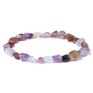 Macro shot of natural irregular amethyst and quartz stone beads on elastic bracelet