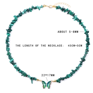 Macro detail of 45cm green stone chip necklace with a 22mm butterfly crystal pendant