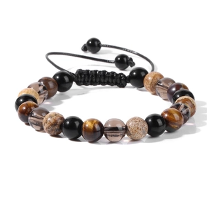 Detalle de pulsera trenzada ajustable con cuentas naturales de ojo de tigre y obsidiana