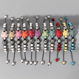 Detailed set of 11 multi-colored stone turtle beaded bracelets with adjustable cords