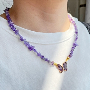 Minimalist purple crushed stone necklace with a translucent butterfly pendant for women