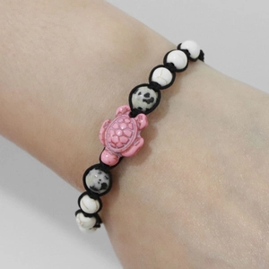 Handmade adjustable turtle bracelet with pink turtle bead and white natural stone beads