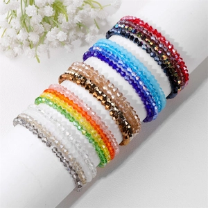 Detailed view of faceted crystal beaded stretch bracelets in various vibrant colors